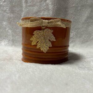 Small orange ceramic pot planter